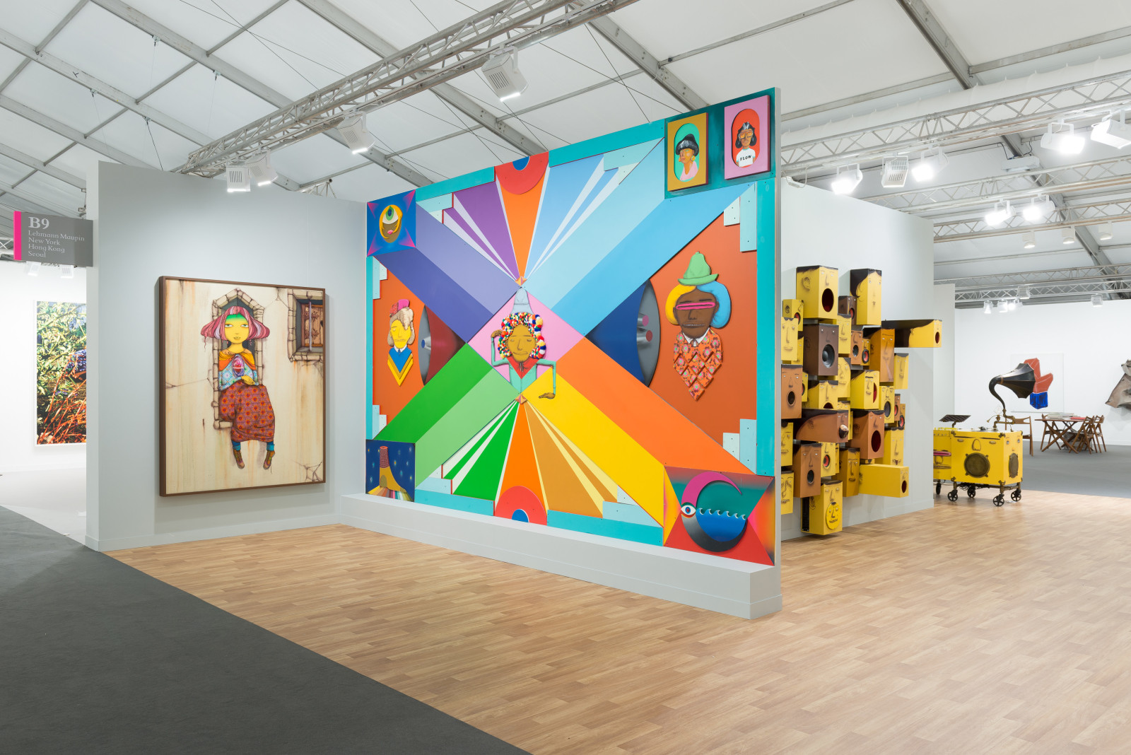 View of Lehmann Maupin's art fair booth at Frieze London 2018 featuring OSGEMEOS, perspective 1