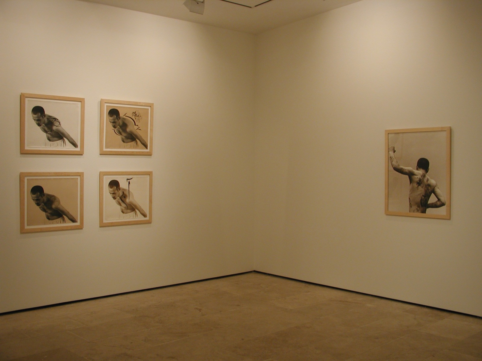 Five framed photographs in the exhibition Sadegh Tirafkan at Lehmann Maupin in New York in 2004