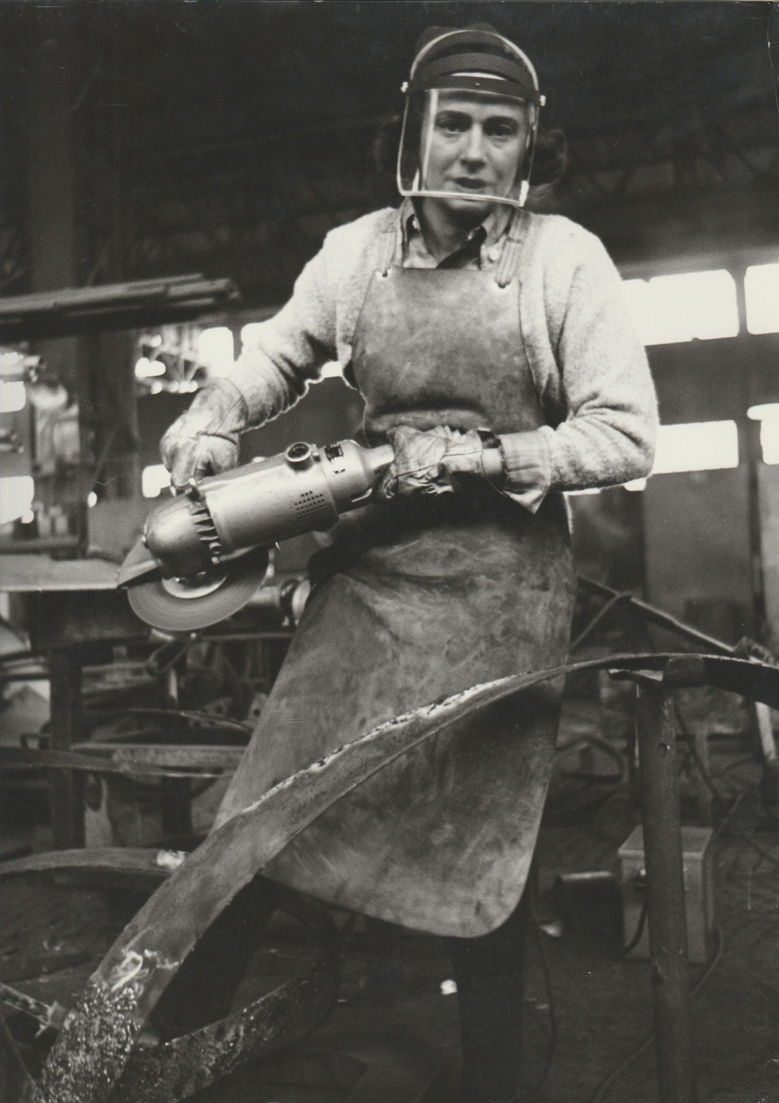 Black and white photograph of Beverly Pepper welding