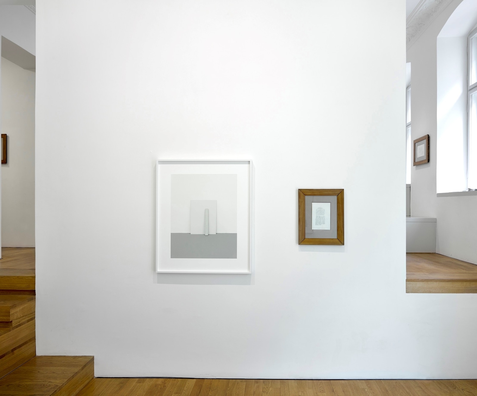 Installation view of photographs framed on the gallery's white walls