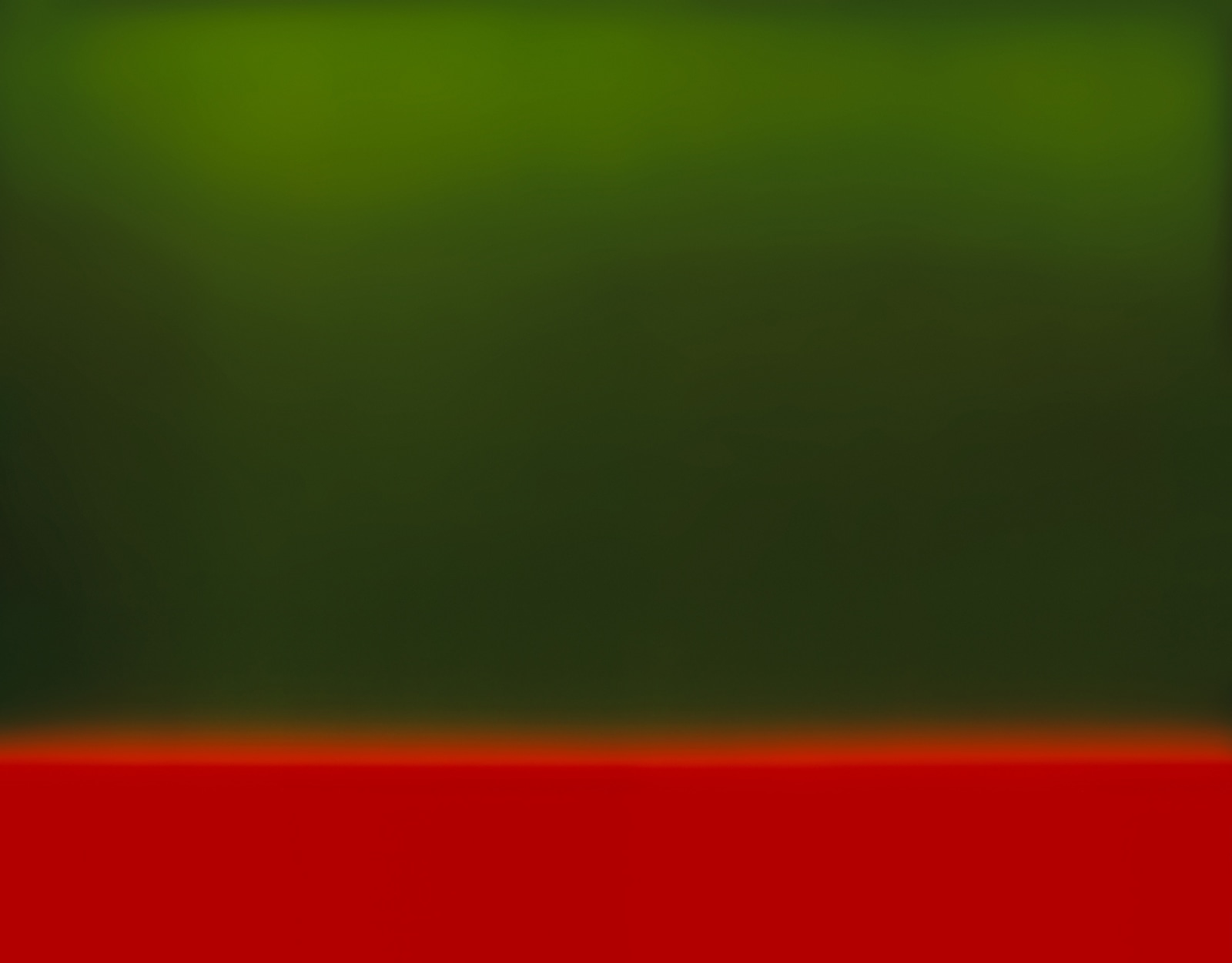 A color field which is mostly green with the bottom being red