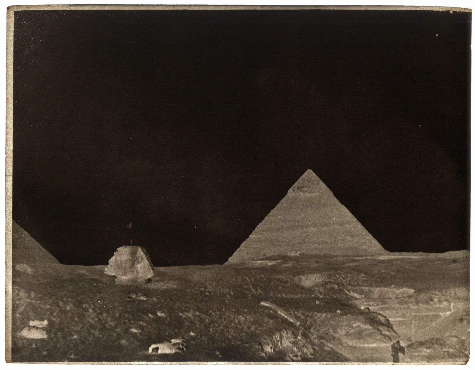 An inverted image of the Egyptian pyramids with a dark sky
