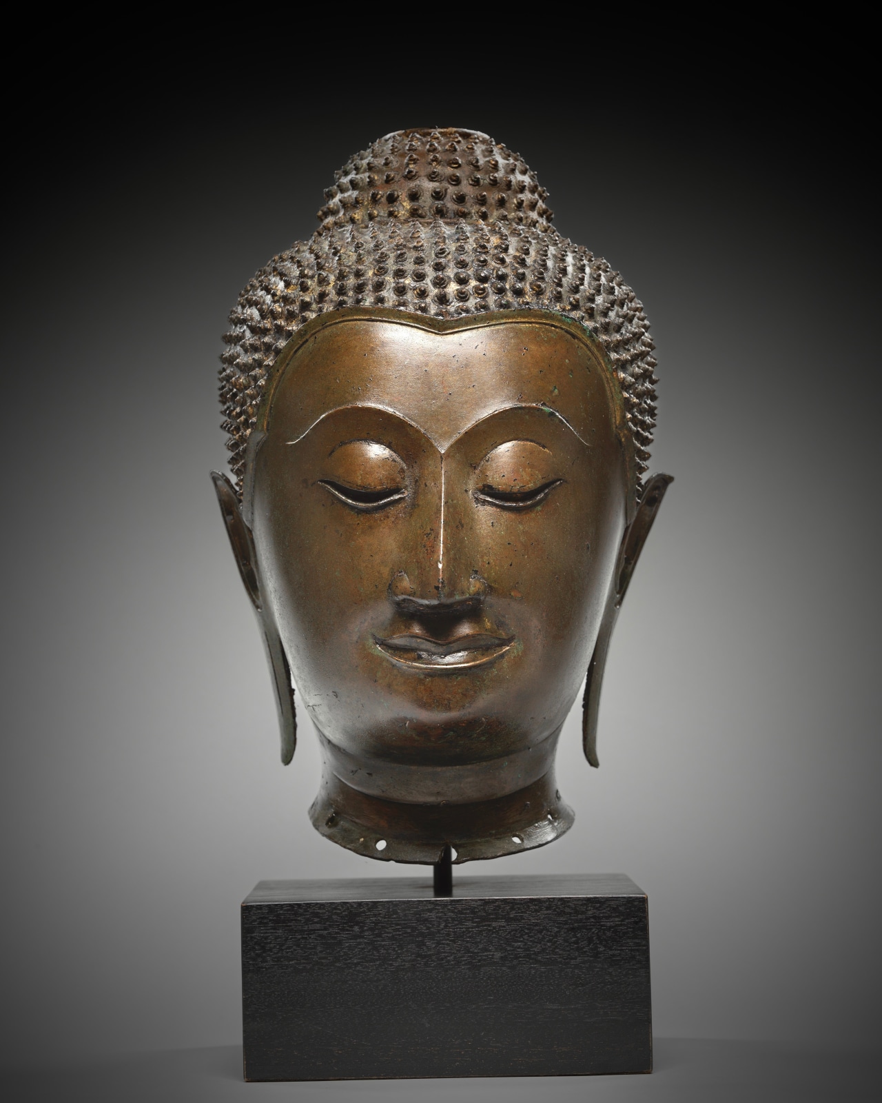 Buddha is portrayed here with a countenance that is both benign and deeply spiritual