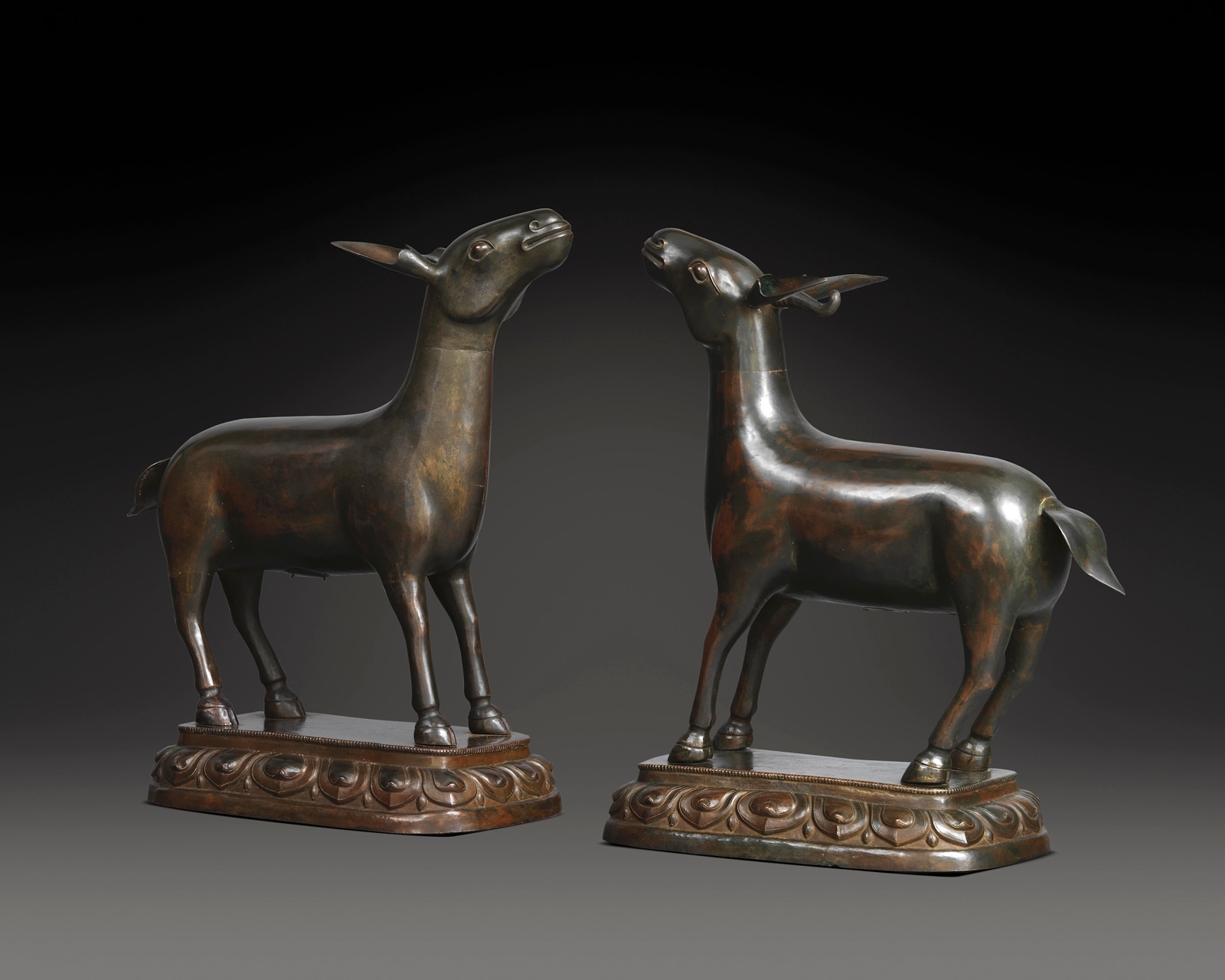 The two deer symbolize the First Turning of the Wheel of Dharma, Sakyamuni Buddha’s first formal sermon after his enlightenment.