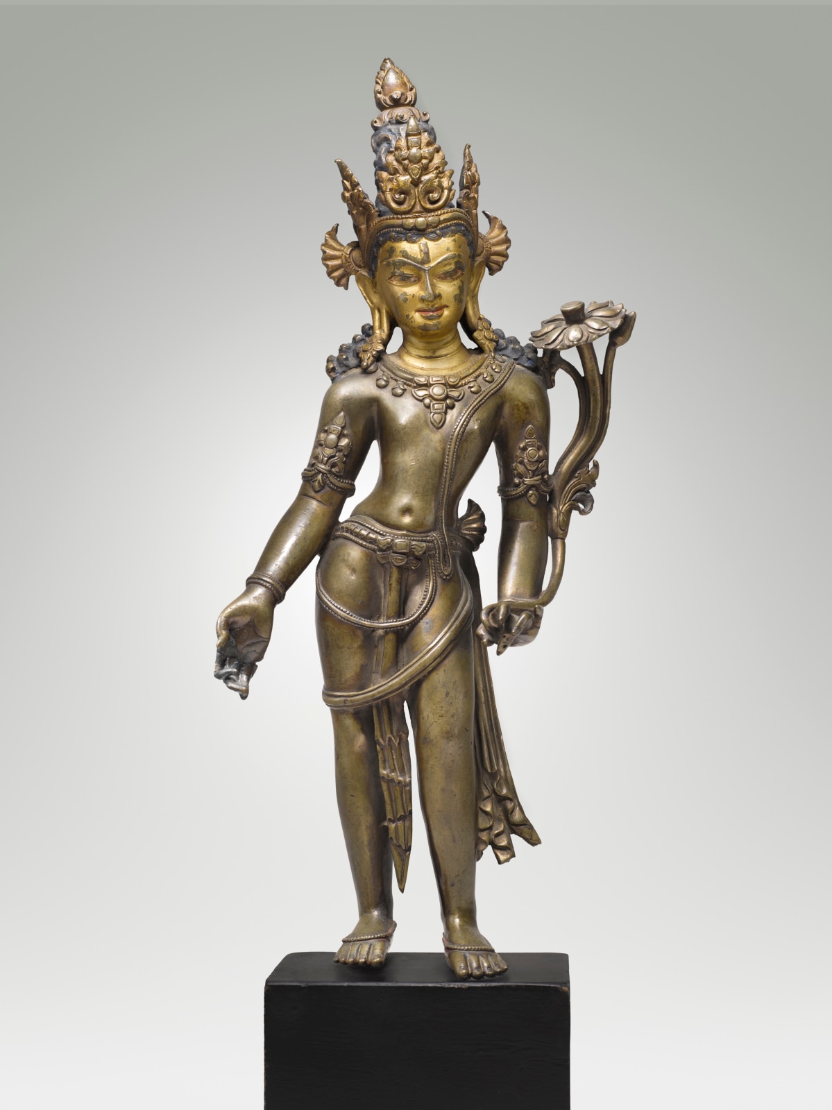 This gracious image of Avalokiteshvara, the Bodhisattva of Compassion, closely adheres to the Pala tradition of Indian Buddhist sculpture. 