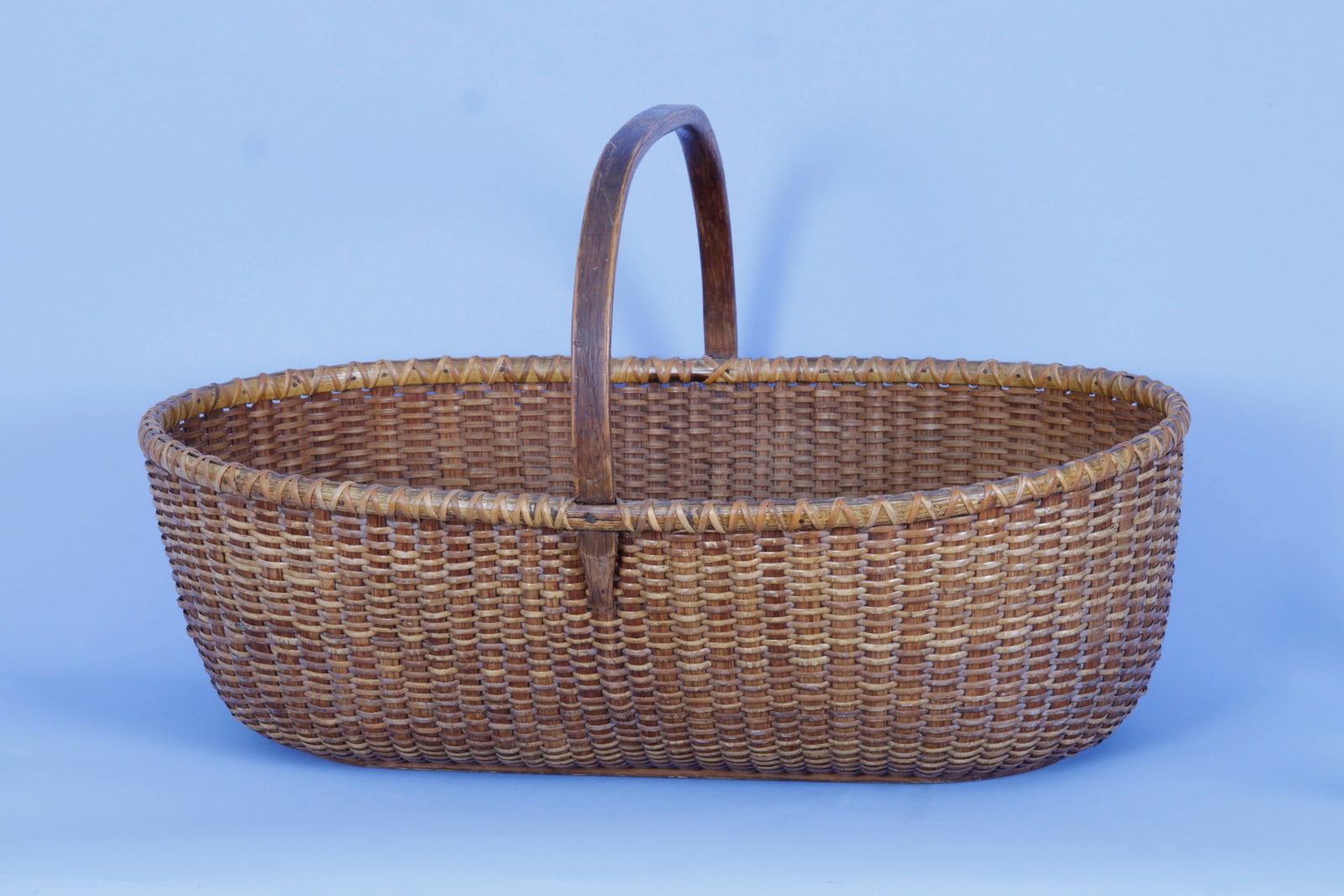 Large Oval Nantucket &amp;quot;Baby Basket&amp;quot; with fixed handle and individually pined oak ribs.