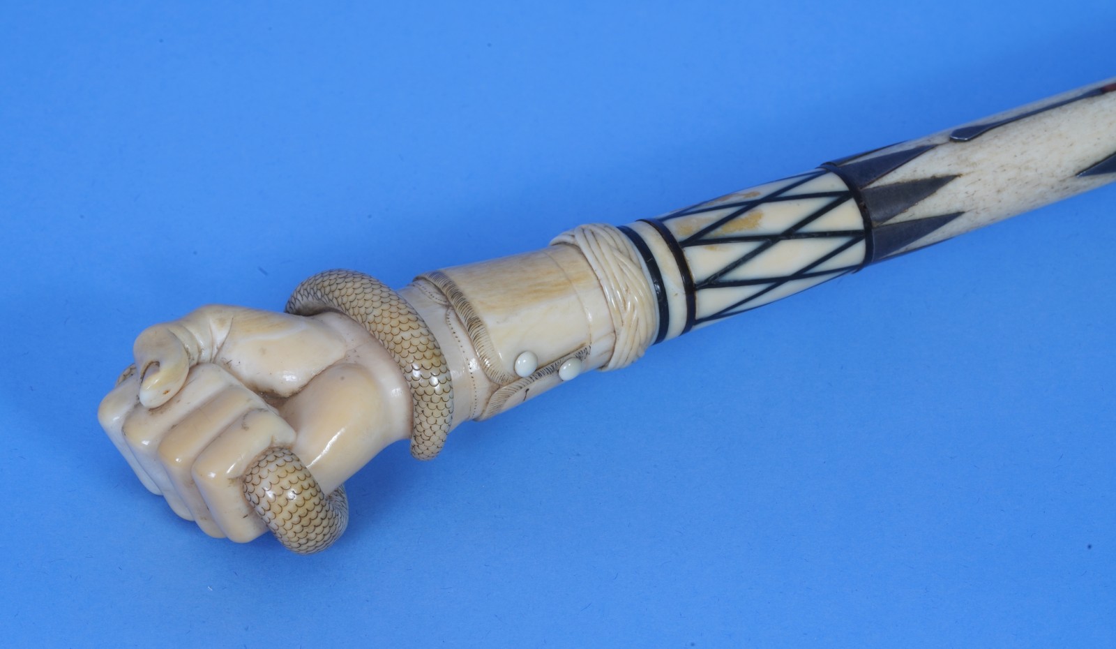 Inlaid Fist Crushing Serpent Cane from the Babara Johnson Collection