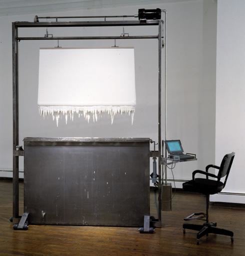 machine dipping linen in white paint