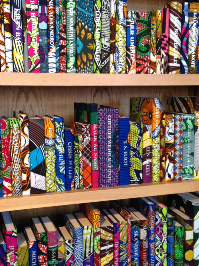 close up of book cases filled with colorful books
