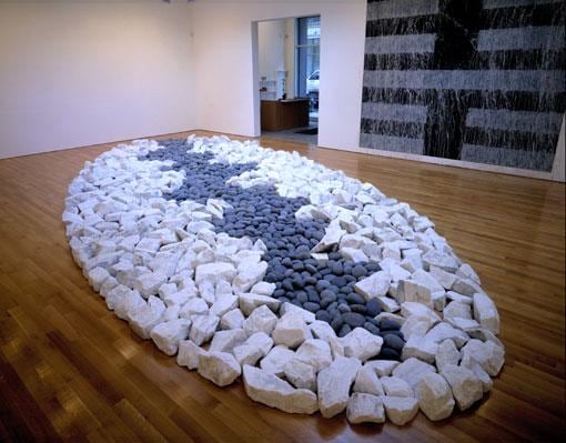 rocks organized in the shape of an oval on the floor