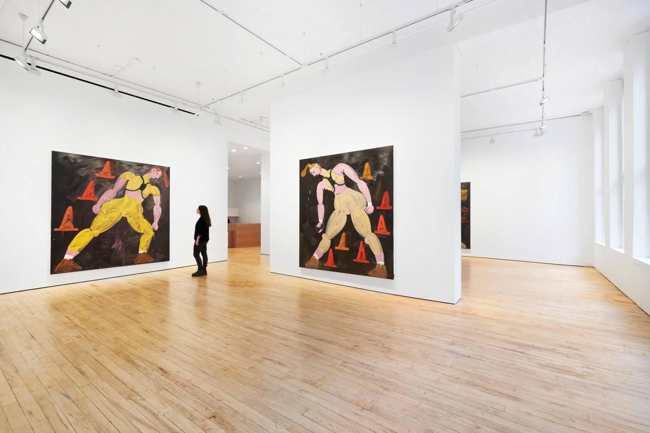 view of the gallery with a person looking at a painting