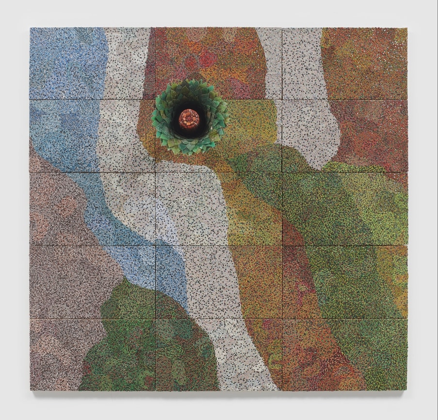 reclaimed electrical wires and components creating a multi-colored pattern on a panel