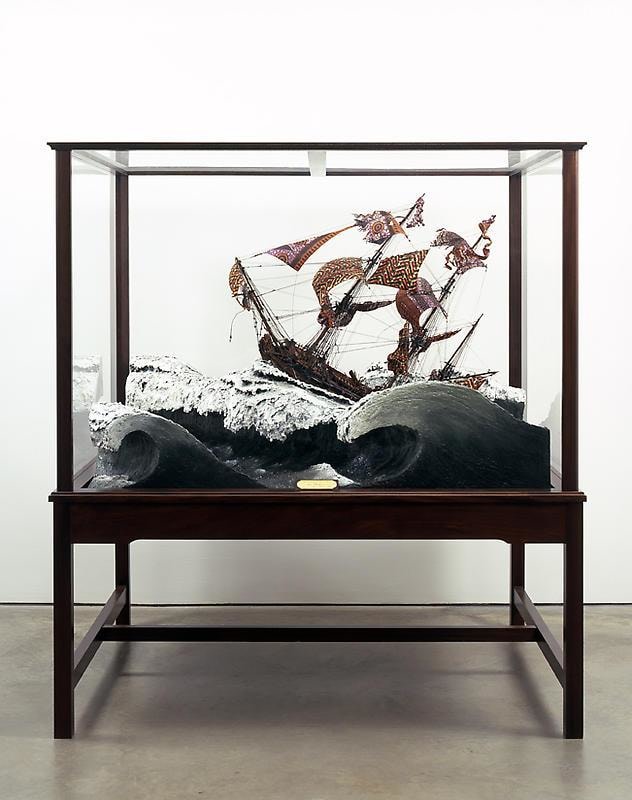 ship navigating roaring waters encased in glass