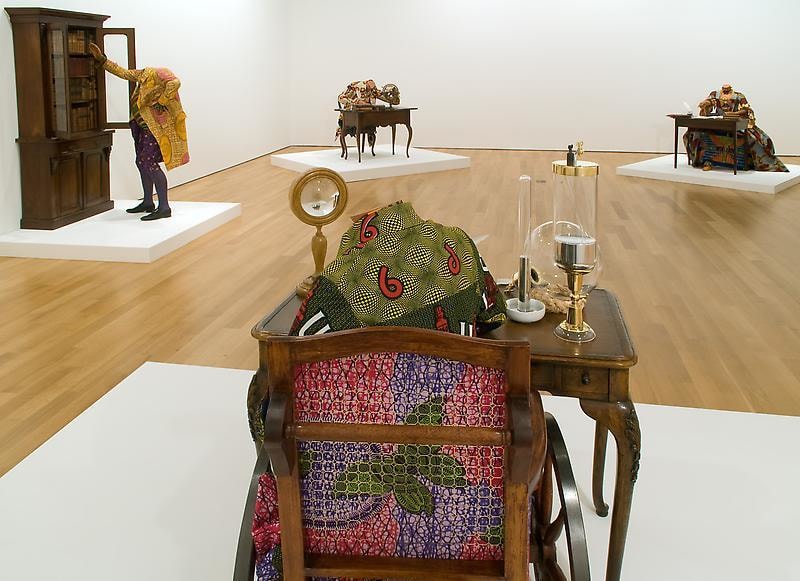 mannequin in a wheelchair wearing a green vest