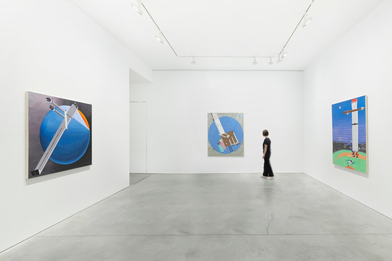 figure in a white gallery with three paintings