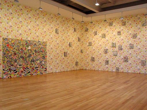 floral wallpaper all over the gallery's walls