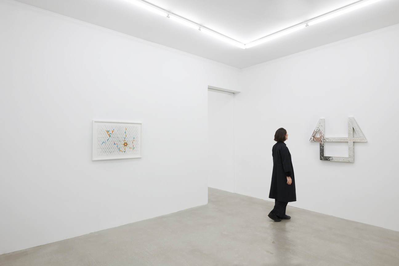 a person observing a glass artwork