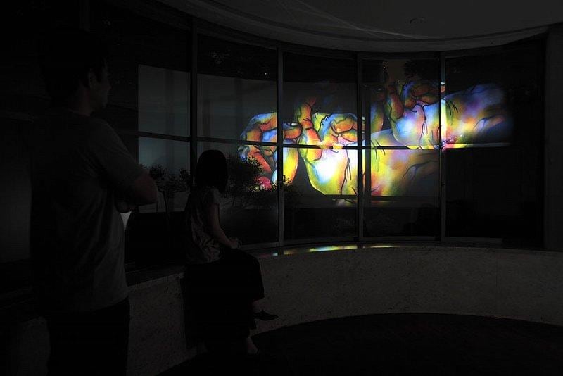 people watching video of contorted feet and hands