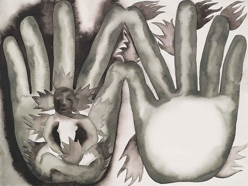 hand with a person on fire while the other hand is on fire