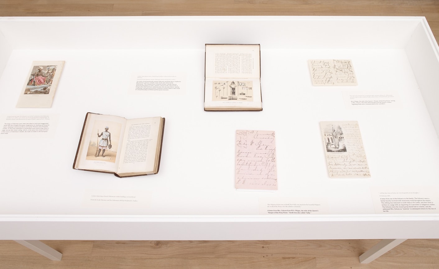 display case with books and old documents