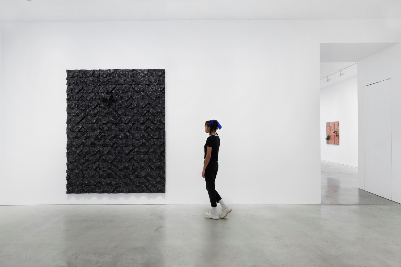 person observing a black artwork