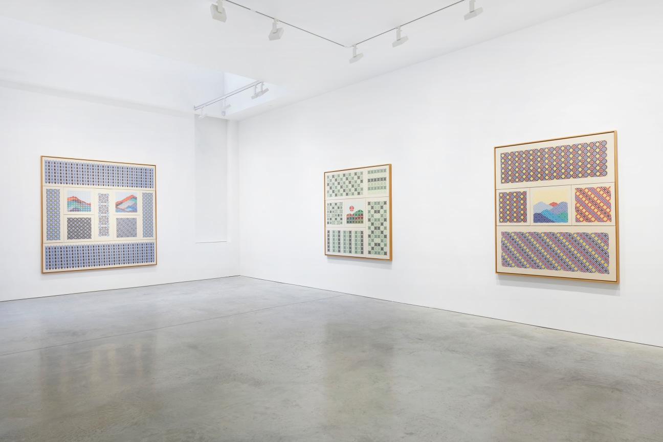 view of three embroidered works