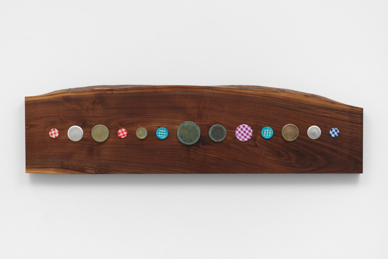 Image of artwork consisting of silver on steel, silver on ceramic, found jam jar lids and bronze on walnut wood by MICHELLE GRABNER, Untitled, 2023.