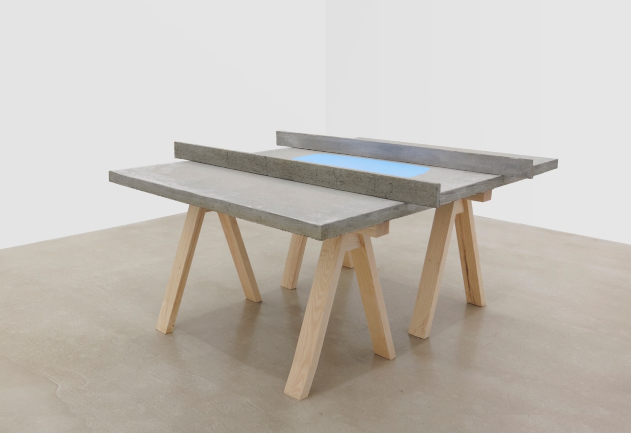 a table  with two rods placed on top of it