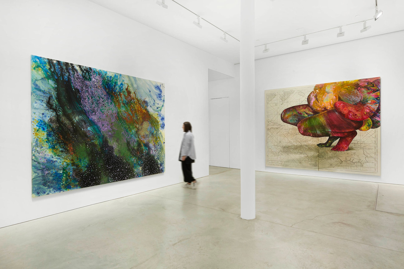 Figure contemplating a blue painting