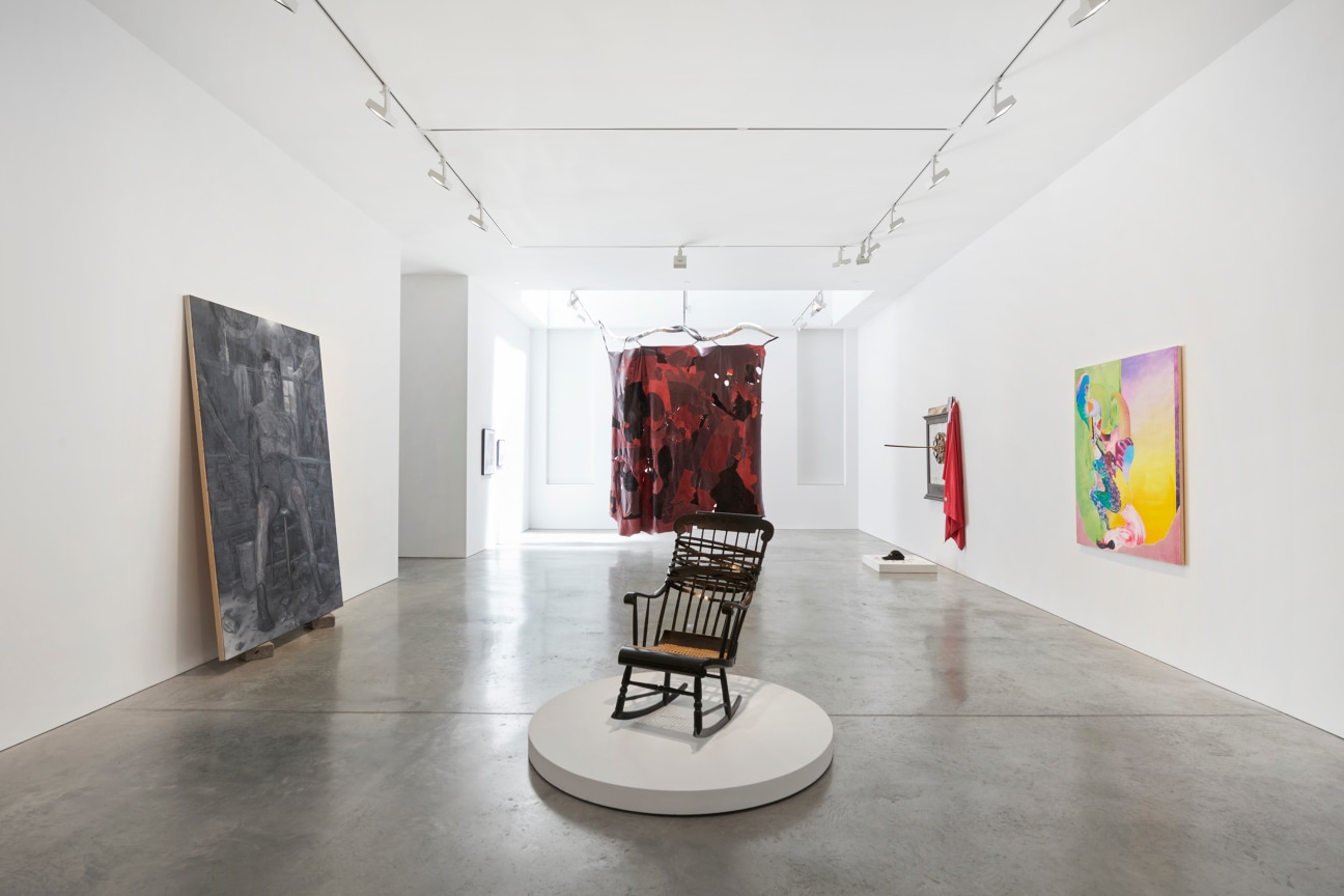 long gallery with several different types of artworks