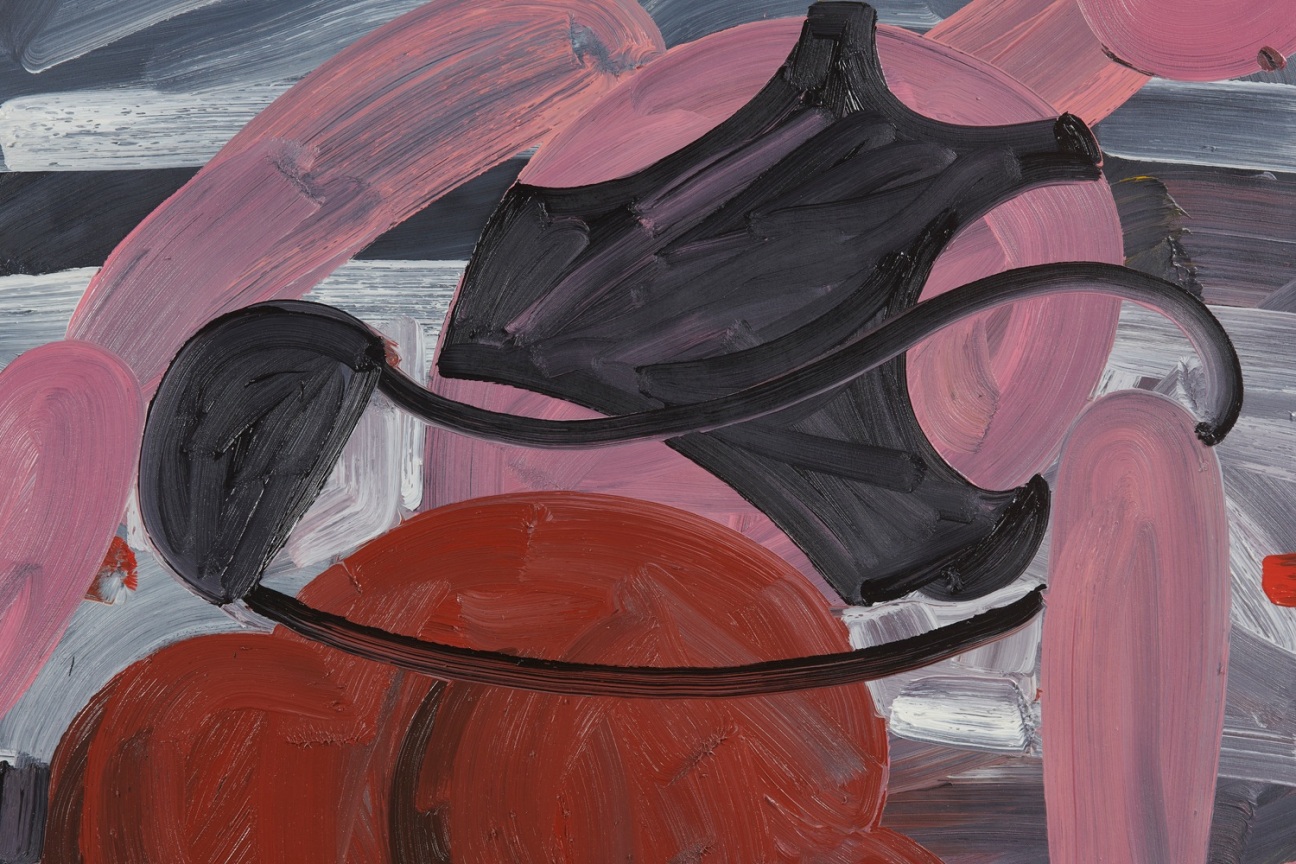 the backside of a woman wearing a black sports bra and red biker shorts