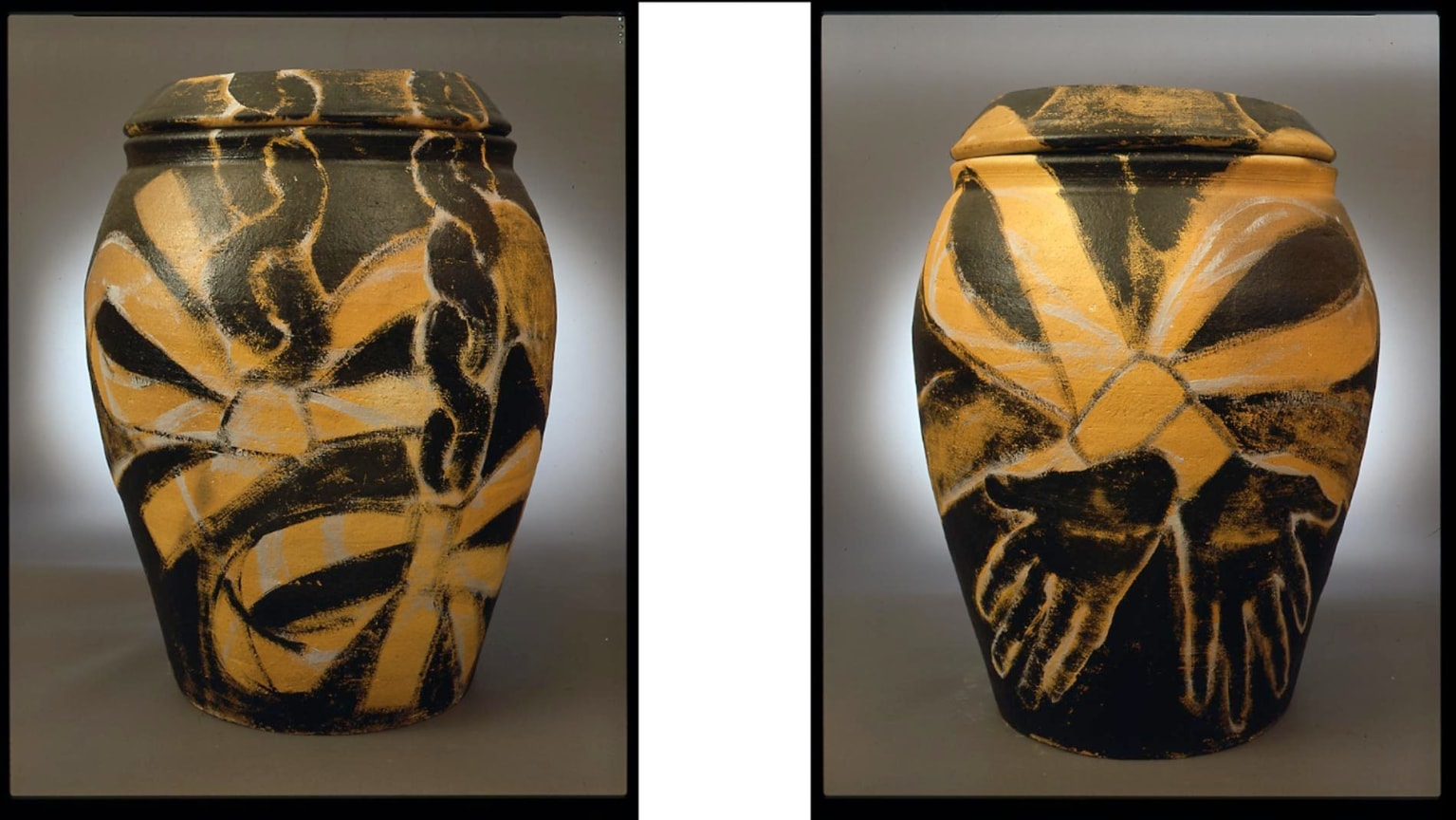 black chains ending in yellow bows in the front; arms tied into a yellow bow in the back