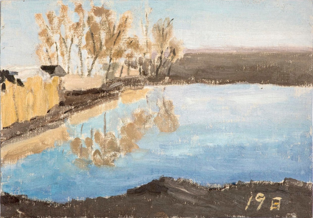 landscape with a beige plants, clear, blue body of water and dirt shores
