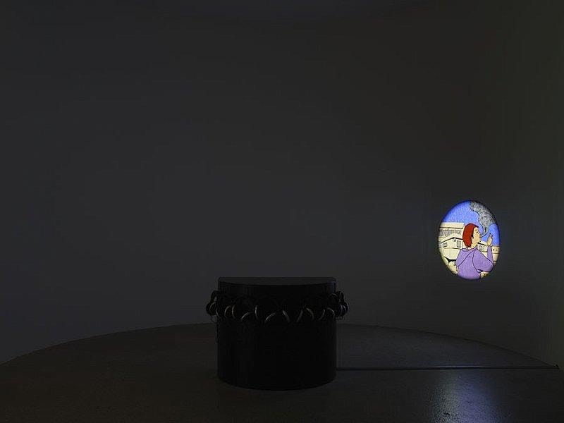 peephole revealing a person smoking being projected onto a dark room