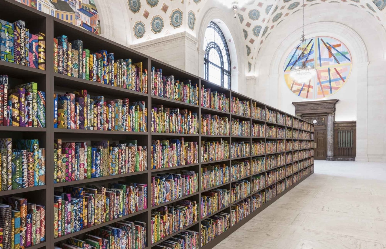 a large bookcase containing a myriad of colorful books