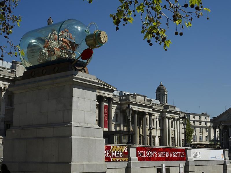 installation view of a sculpture of a ship inside a bottle