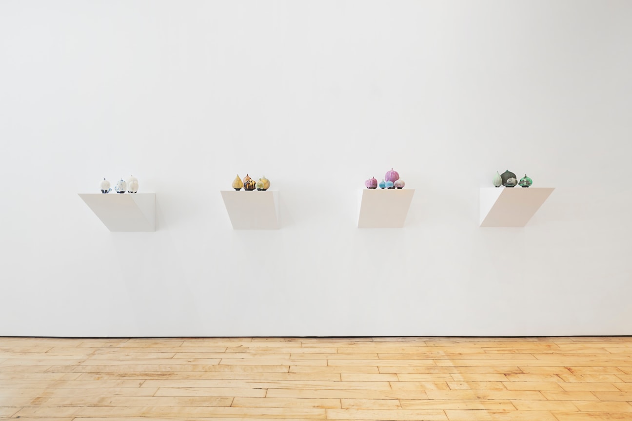 several small sculptures on pedestals