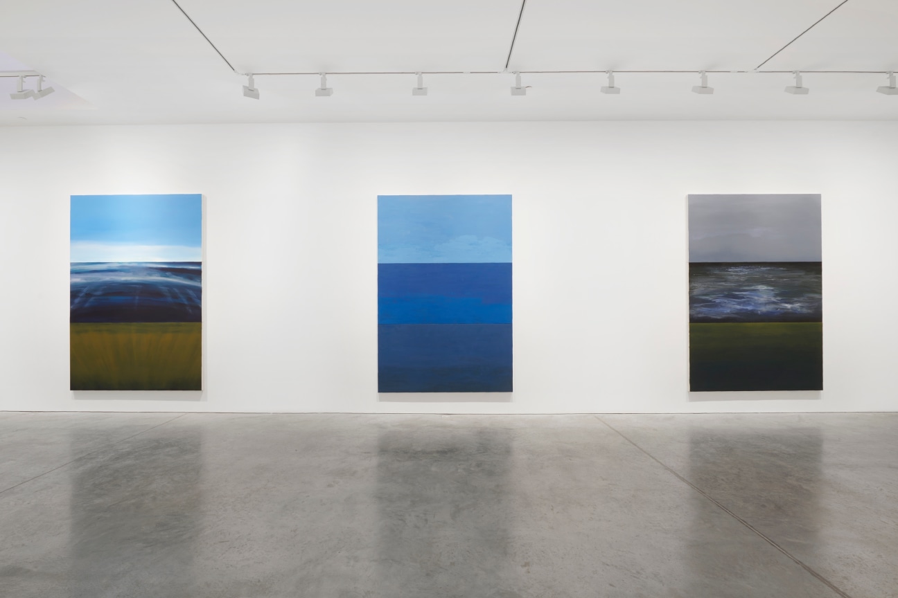 view of three paintings