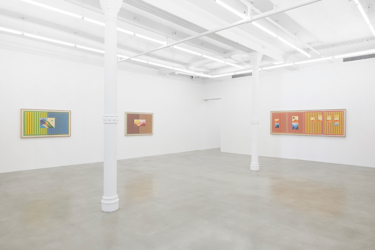 view of white gallery with three embroidered artworks