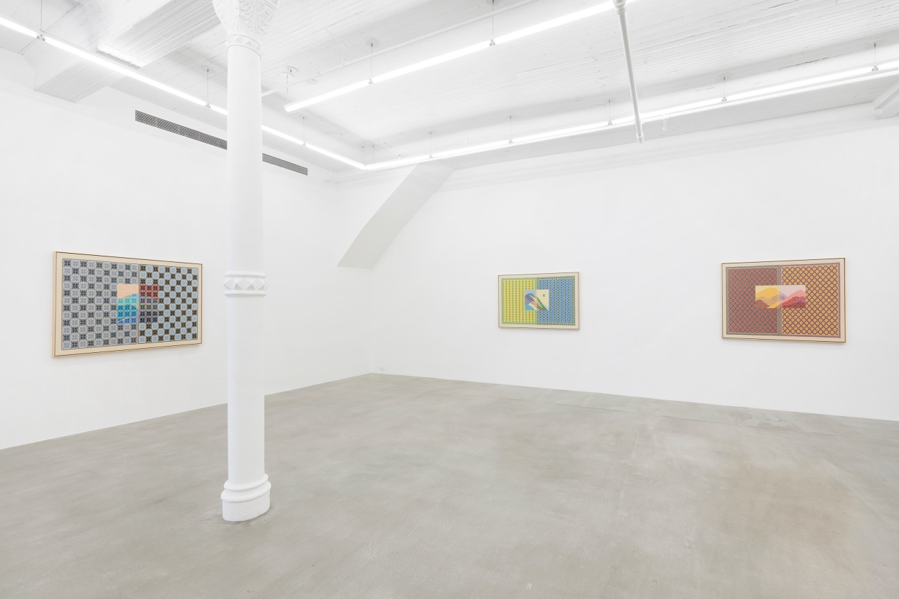 view of white gallery with three embroidered artworks