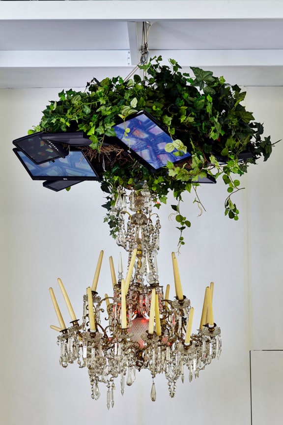 , NAM JUNE PAIK&nbsp;Video Chandelier No. 4,&nbsp;1990&nbsp;Video monitors, chandelier, candles, tree leaves&nbsp;59 x 59 x 59 in. (150 x 150 x 150 cm)