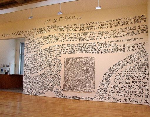 words scribbles on the gallery walls around a black and white painting