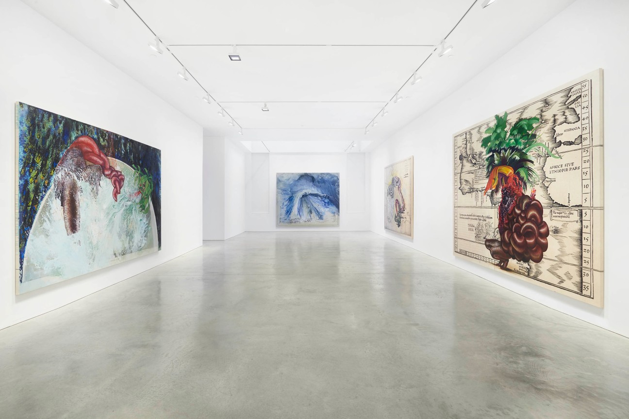 view of long gallery with three paintings installed