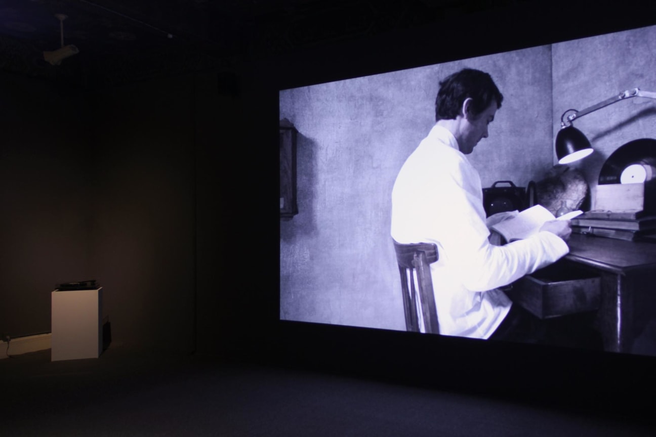 video projection next to a modern record player