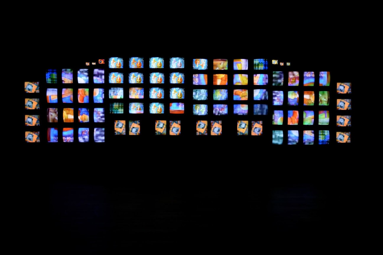 installation view of multiple TV screens