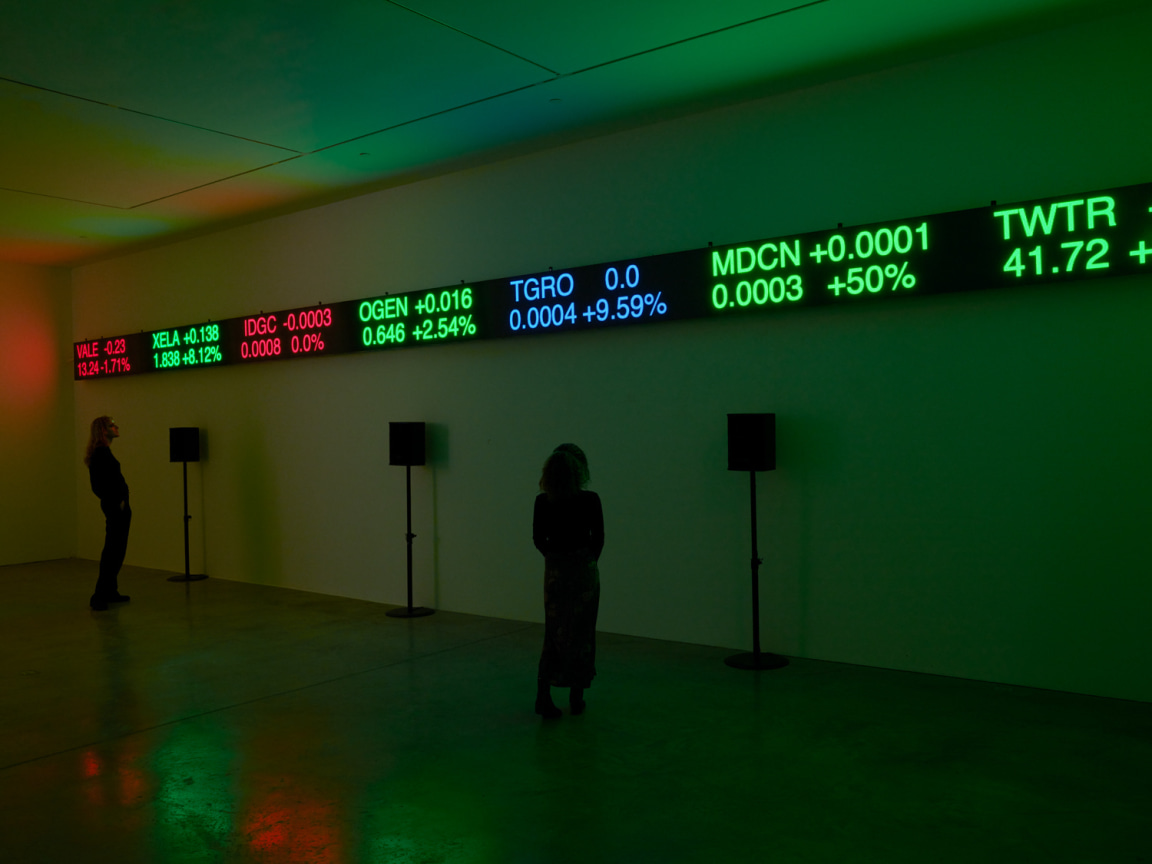 people observing the display of stock information