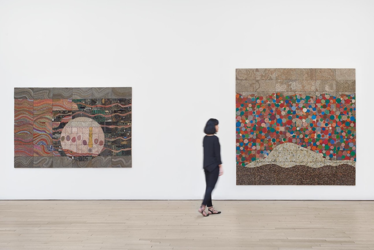 woman walking up to an artwork