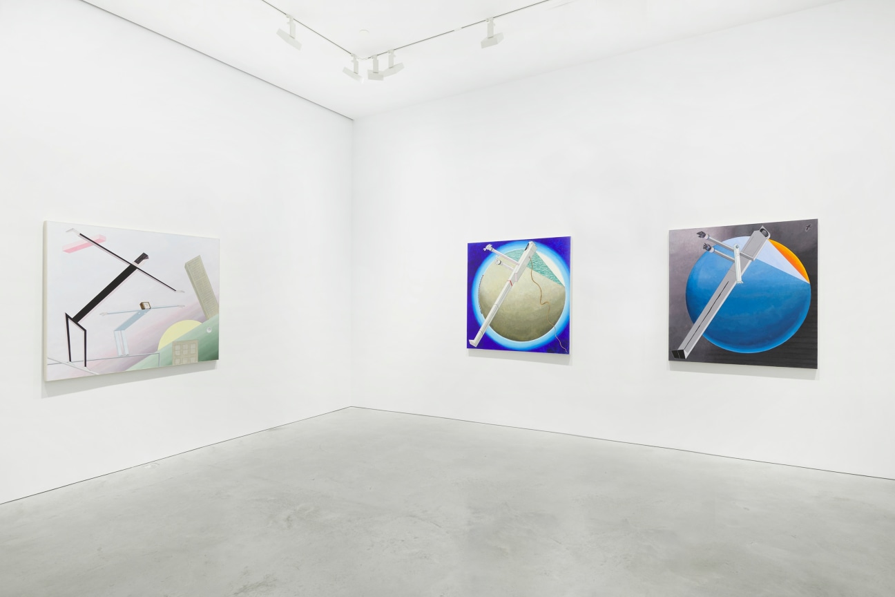 white gallery with three paintings