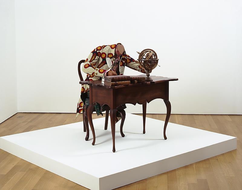 mannequin writing on a notebook