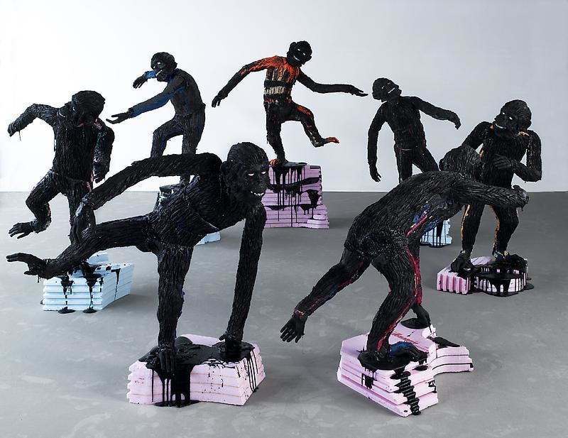 apes on pink and blue pedestals